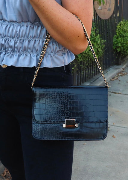 Black crossbody purse with gold hardware