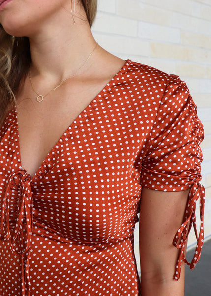 Copper color dress with white polka dots