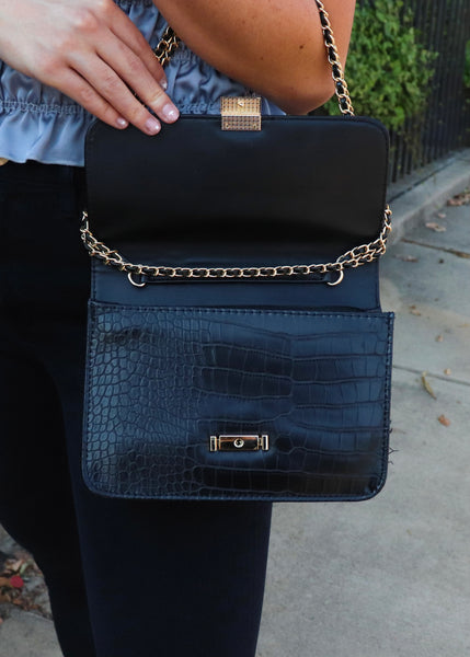 Black crossbody purse with gold hardware