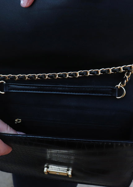 Black crossbody purse with gold hardware