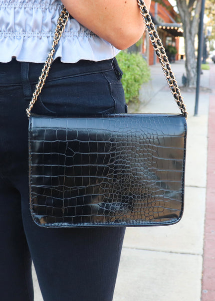 Black crossbody purse with gold hardware