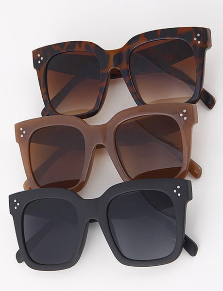 Large framed sunglasses with three dot silver detail on the front and sides of frames